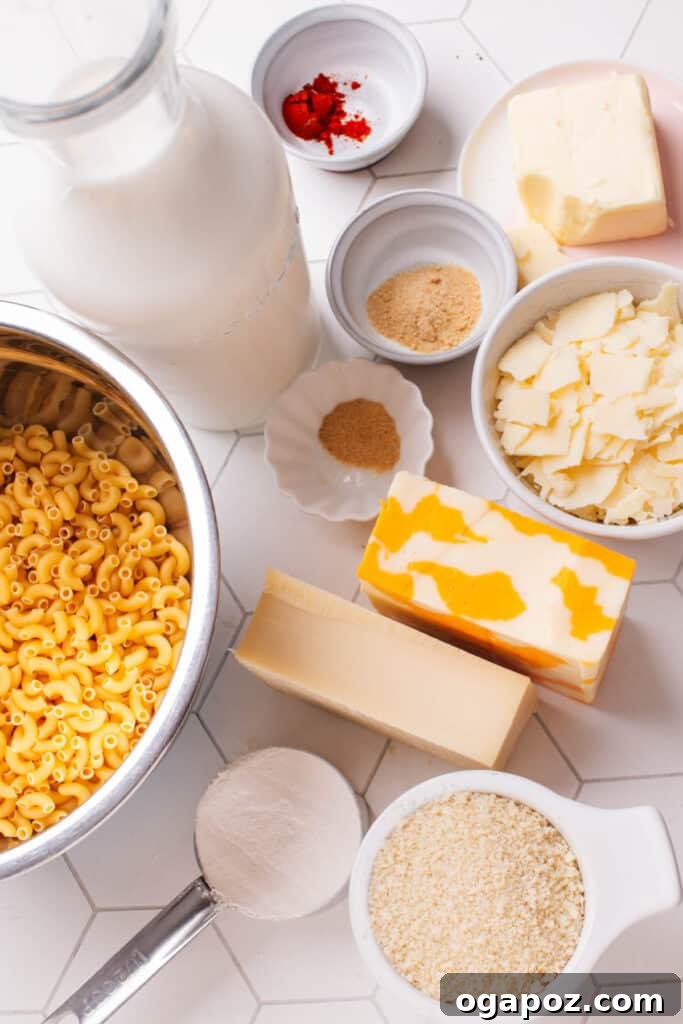 Beyond the Bowl: Essential Sides to Elevate Your Mac and Cheese 24 Ingredients laid out for baked macaroni and cheese, including pasta, various cheeses, and seasonings.