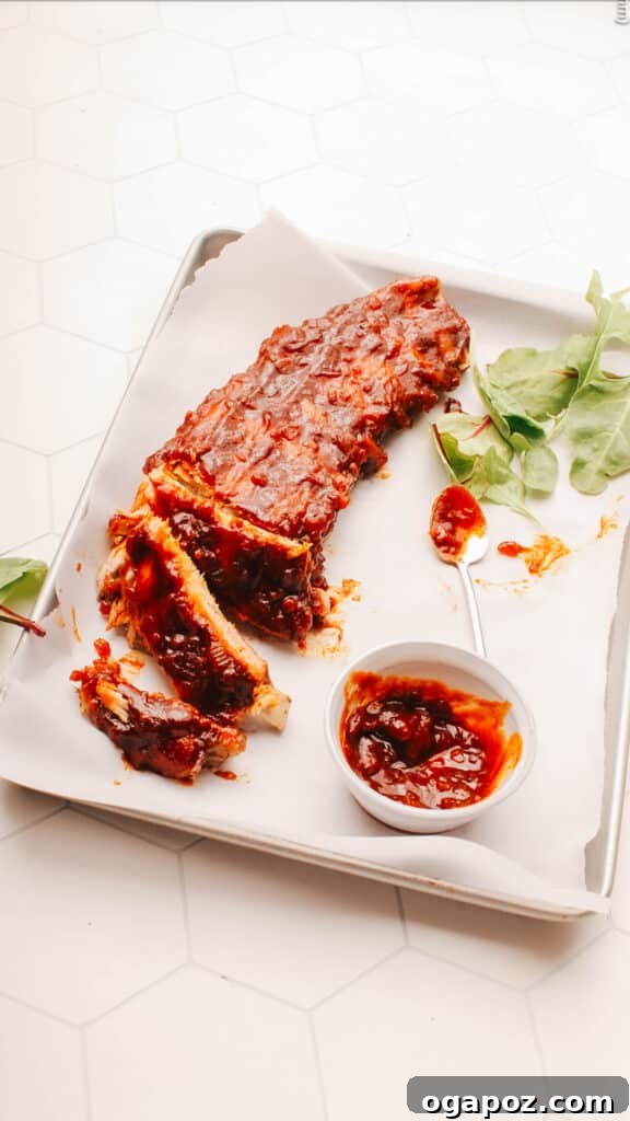 Beyond the Bowl: Essential Sides to Elevate Your Mac and Cheese 4 Spicy sticky ribs glistening with extra sauce, arranged appetizingly on a plate.