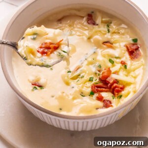 Easy potato soup in a bowl with a spoon, showing its thick, creamy texture, ready to be enjoyed.