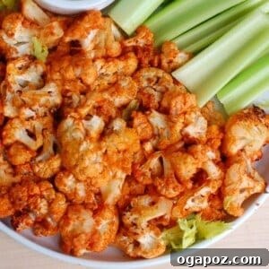 Buffalo Cauliflower Wings 9 Roasted Buffalo Cauliflower on a platter with dipping sauce