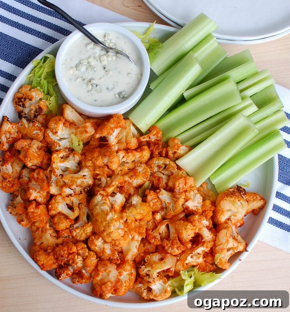 Buffalo Cauliflower Wings 5 Roasted Buffalo Cauliflower florets in a large bowl, ready to be served