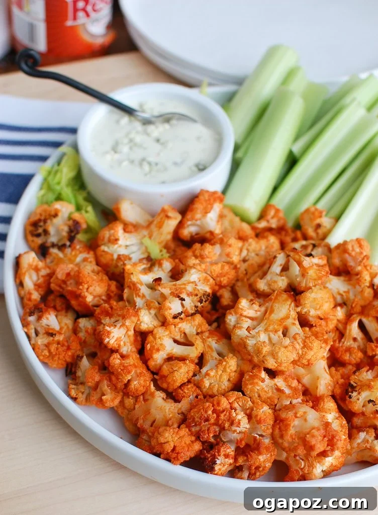 Buffalo Cauliflower Wings 8 A large white platter filled with Roasted Buffalo Cauliflower and blue cheese dressing