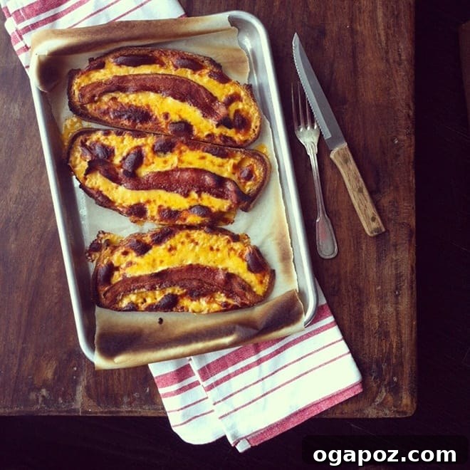 Bacon Cheese Bombs 2 Golden brown Cheesy Bacon Humps, fresh out of the broiler, on a baking sheet