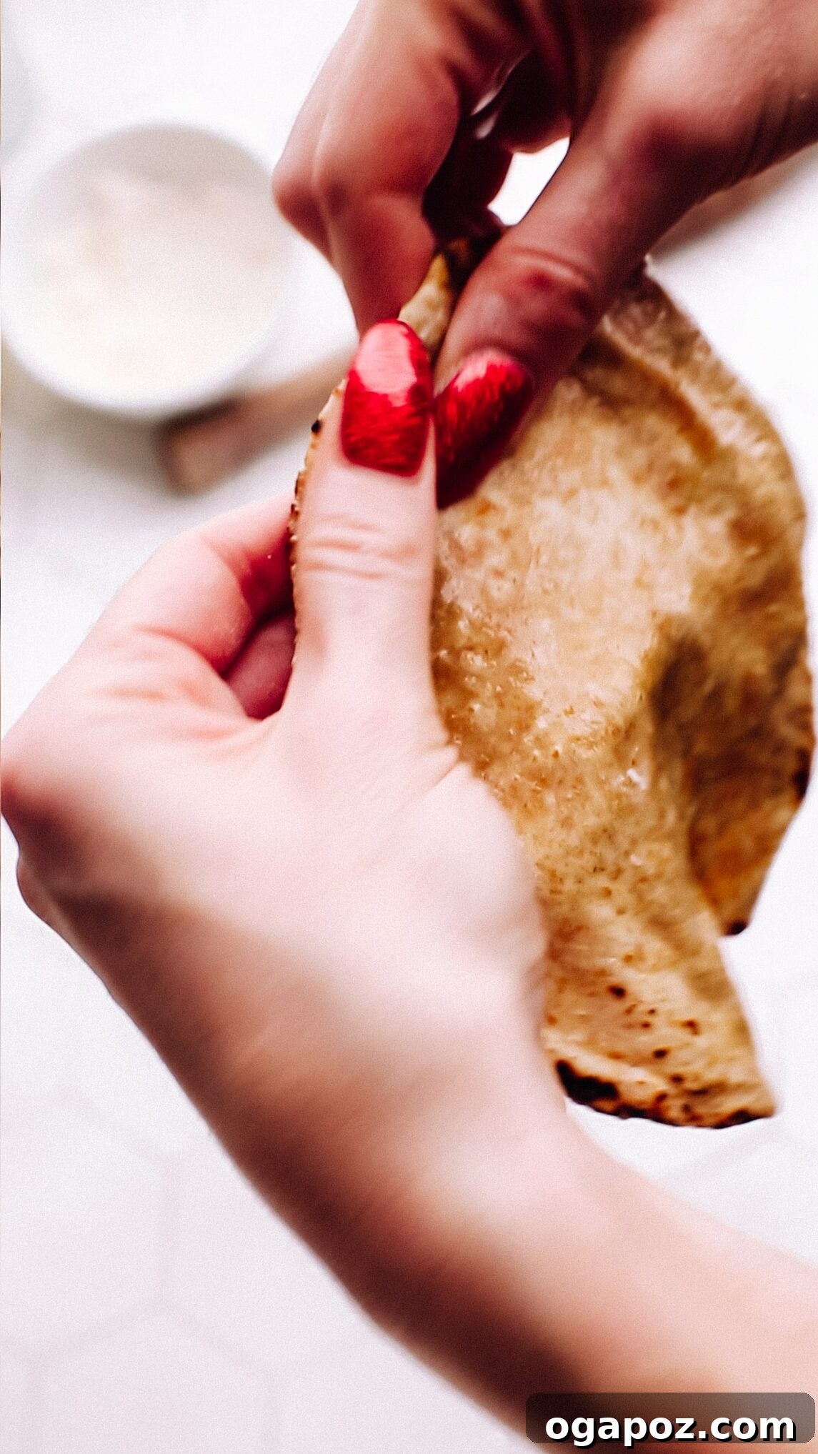 Pillowy Soft Roti A Time Tested Family Favorite 18 Holding soft roti.