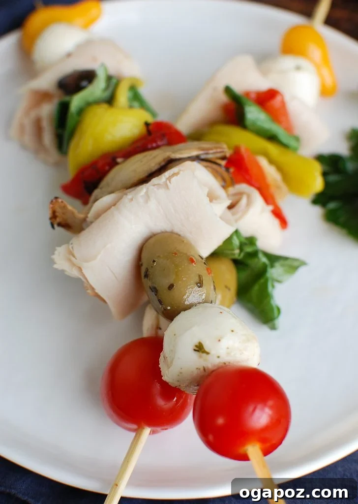 Two Mediterranean Antipasto Skewers neatly arranged, highlighting the fresh ingredients and vibrant colors.