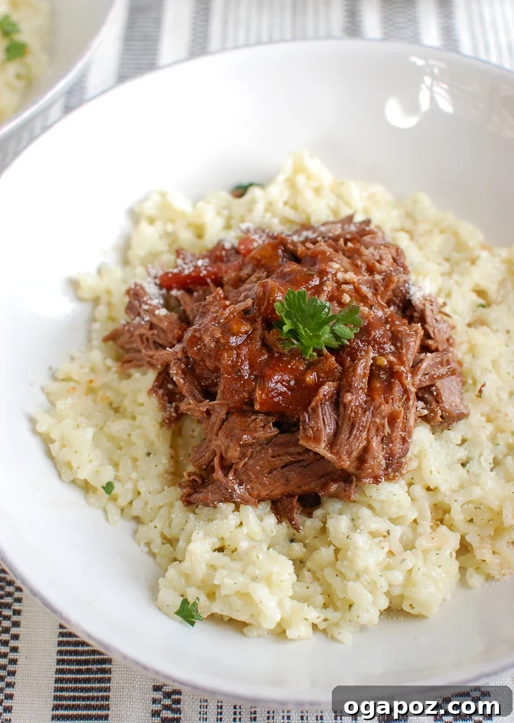 Meltingly Tender Slow Cooker Italian Short Ribs 4 Slow Cooker Italian Short Ribs plated with creamy risotto and fresh herbs.