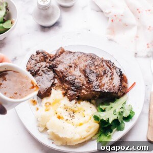 Instant Pot Steak: Fork-Tender Perfection with Savory Pan Sauce 15 Instant Pot Steak garnished with sauce.