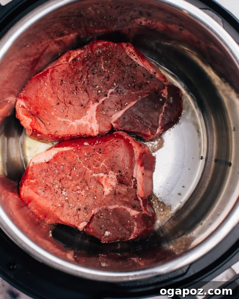 Instant Pot Steak: Fork-Tender Perfection with Savory Pan Sauce 7 Searing steak in the Instant Pot liner.
