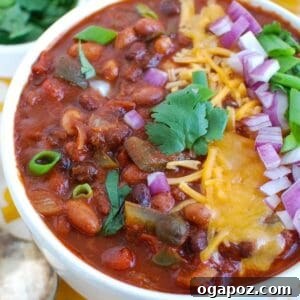 A large bowl of Slow Cooker Vegetarian Chili, garnished and ready to serve