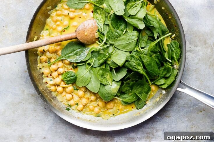 Vegan Coconut Curry Chickpeas with Wilted Greens