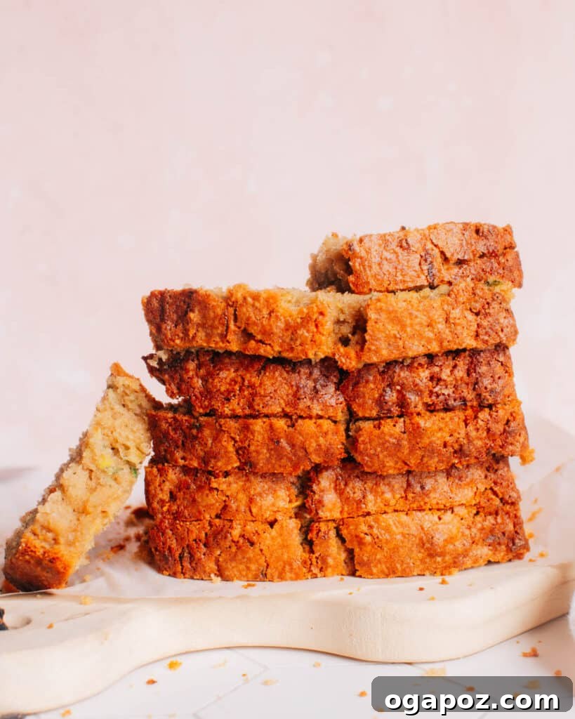 Zucchini Bread That Stays Soft and Moist 5 A stack of perfectly sliced zucchini bread, ready to be enjoyed.