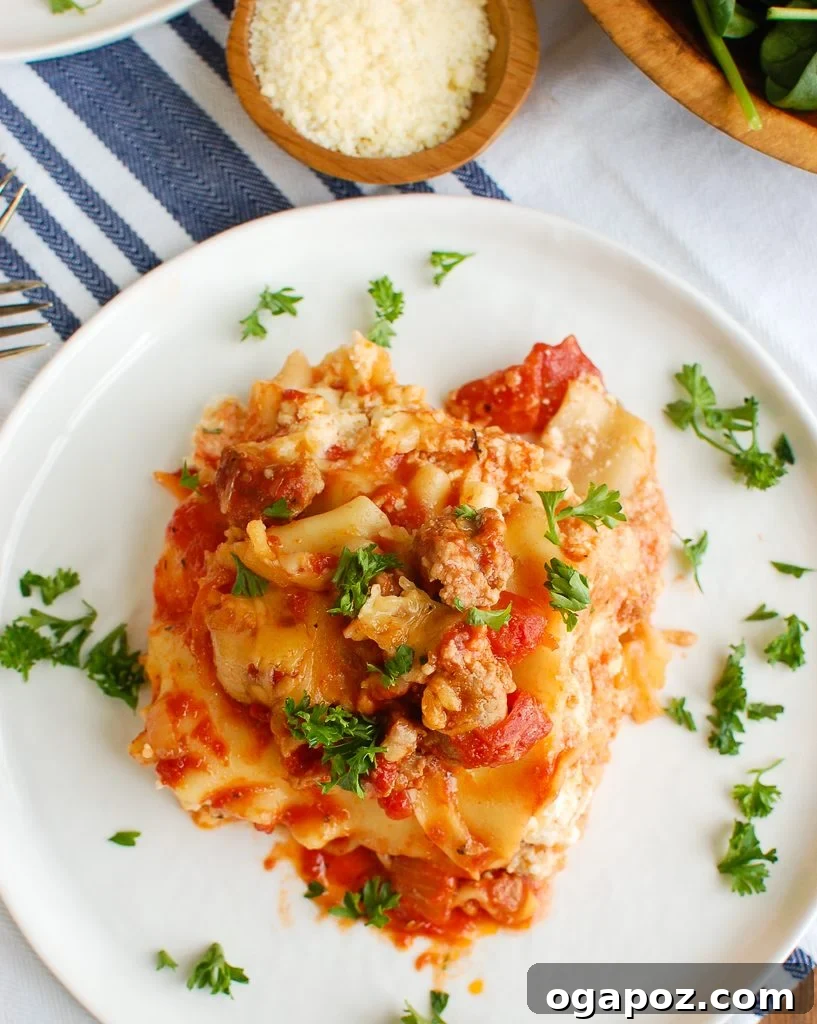 Slow Cooker Lasagna Perfection 4 Slow Cooker Lasagna from above, garnished with fresh parsley and basil, ready to be sliced