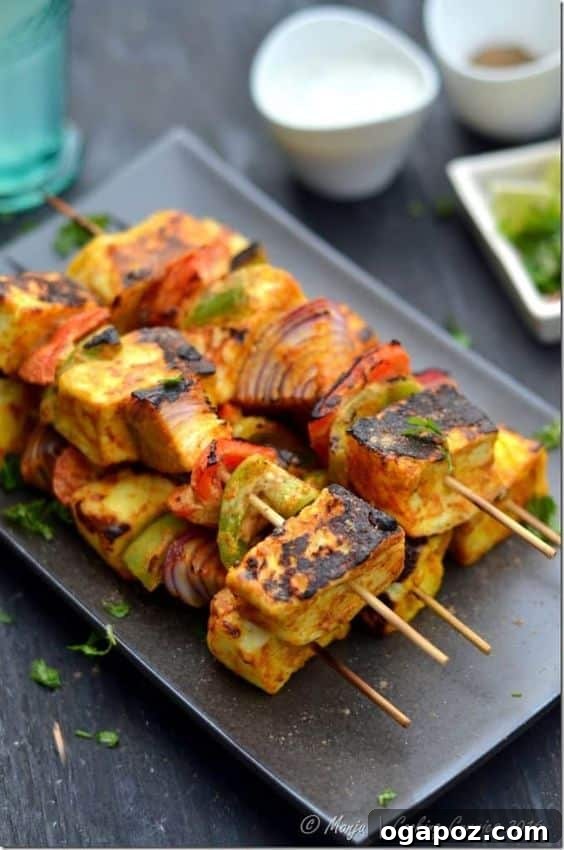 Paneer Perfection: 52+ Recipes for Every Palate 15 Flavorful Tikka-Grilled Paneer Skewers, charred to perfection, served as a delicious vegetarian main or side.