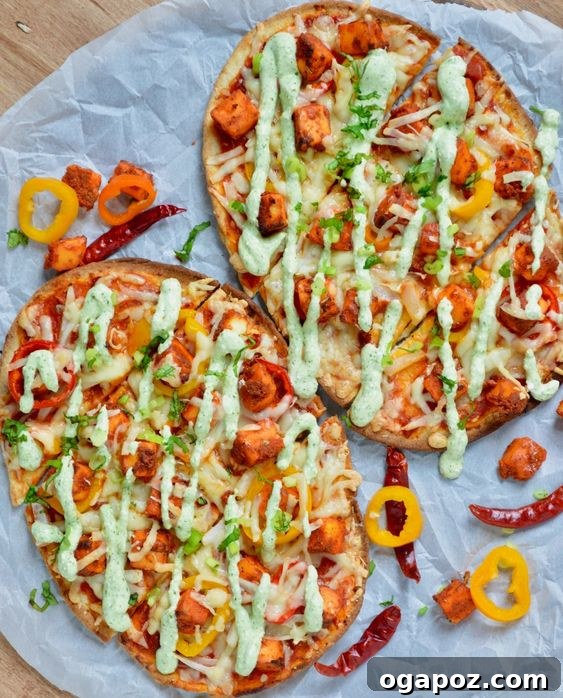 Paneer Perfection: 52+ Recipes for Every Palate 45 Creative Paneer Naan Pizza, a delicious fusion of Indian and Italian flavors on a crispy naan base.