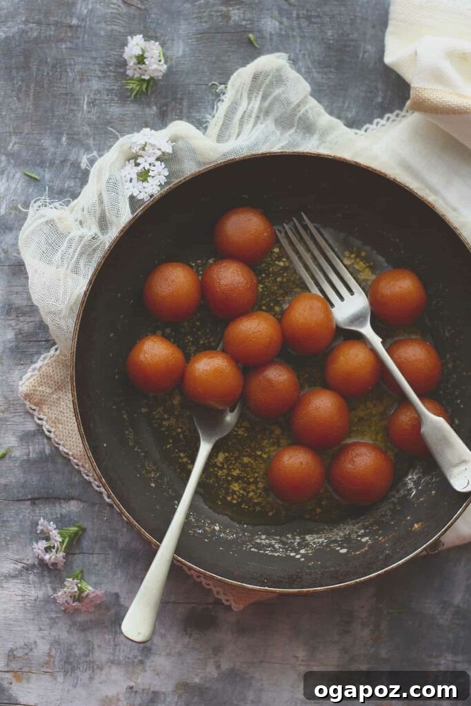 Paneer Perfection: 52+ Recipes for Every Palate 50 Syrup-soaked Paneer Gulab Jamun, a truly delicious and decadent Indian sweet treat, made with simple ingredients.