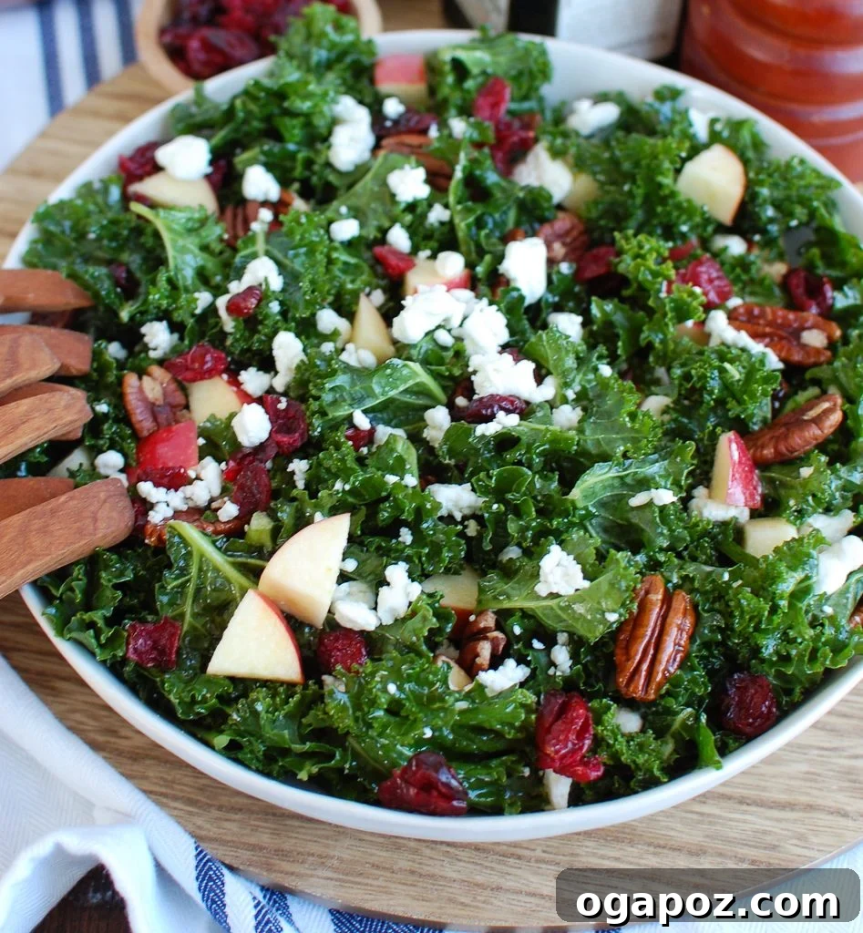 Kale Salad with Cranberries served on a wooden plate