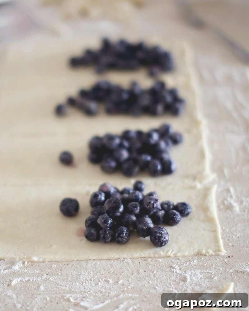 Closeup of rustic blueberry hand pies with a beautiful crust