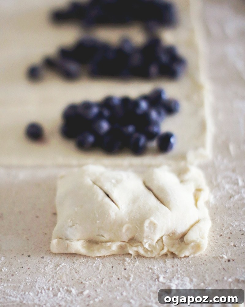 A freshly baked blueberry hand pie on a cooling rack