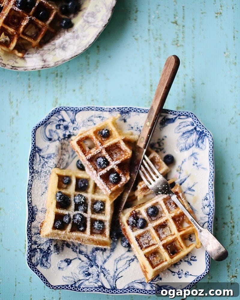 Golden-brown yeasted waffles ready to be served with fresh toppings