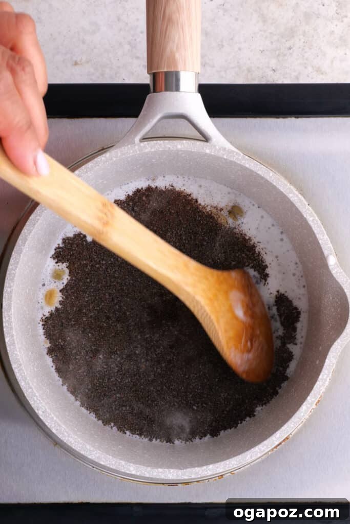 Authentic Indian Masala Chai 4 adding the black tea to the milk mixture