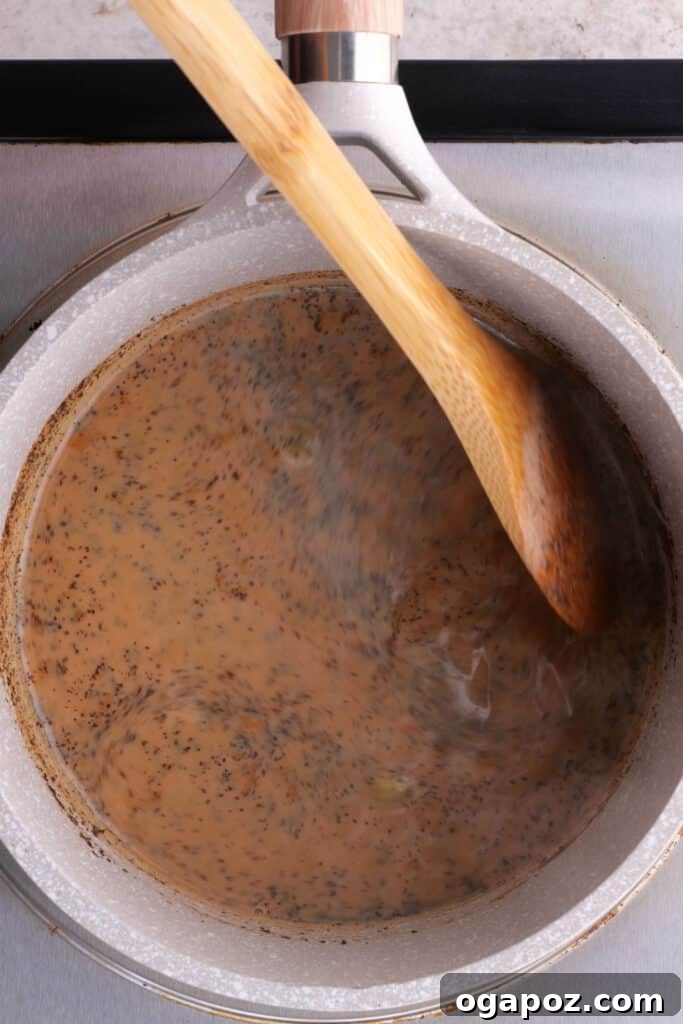 Authentic Indian Masala Chai 5 mixing the black tea and milk
