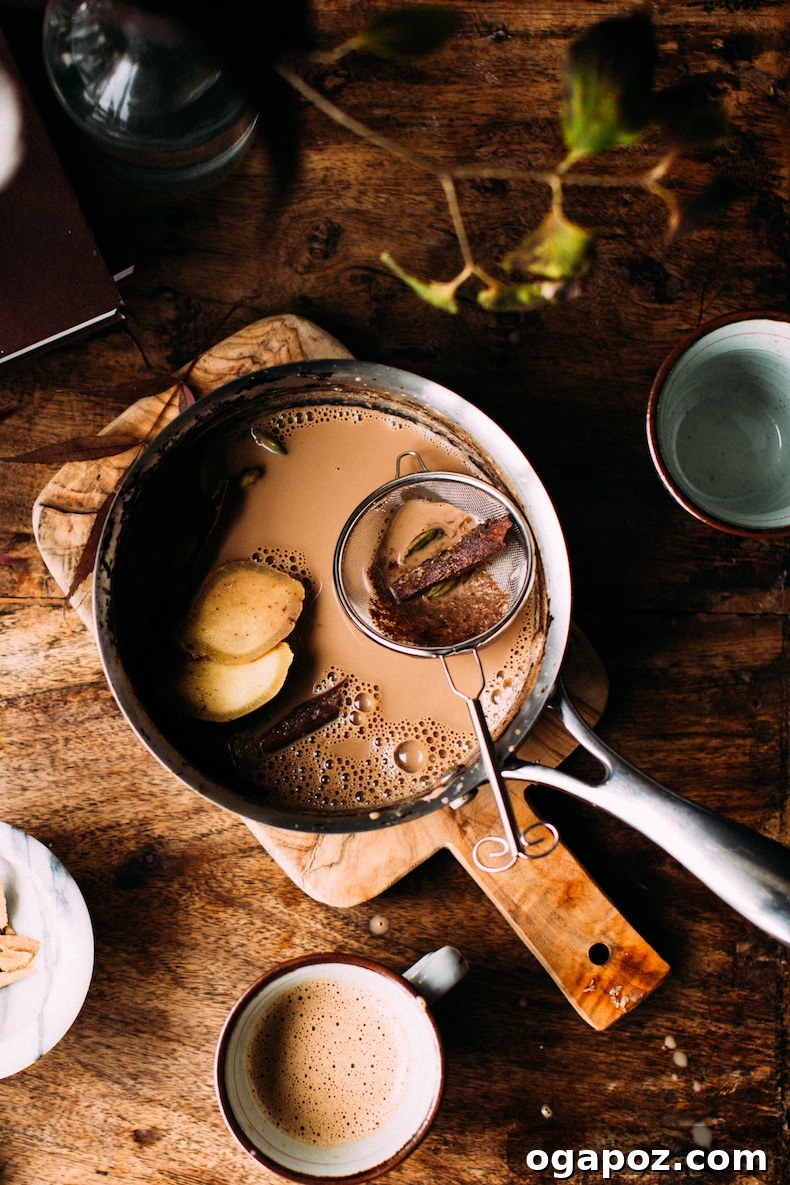 Authentic Indian Masala Chai 7 indian chai tea from scratch in a pot with whole cinnamon
