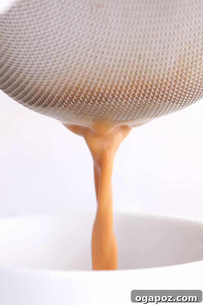 Authentic Indian Masala Chai 8 filtering the tea granules
