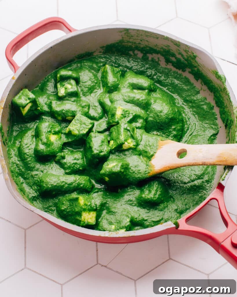 Velvety Palak Paneer 2 Palak Paneer in pan, creamy green curry with white paneer cubes