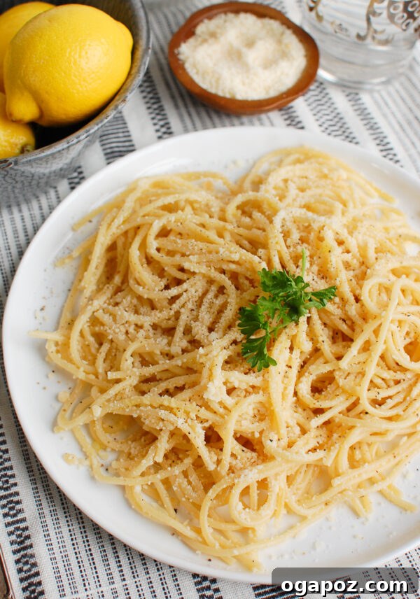 Bright Lemon Pasta 3 Lemon Pasta topped with fresh parsley, emphasizing its simplicity and freshness.
