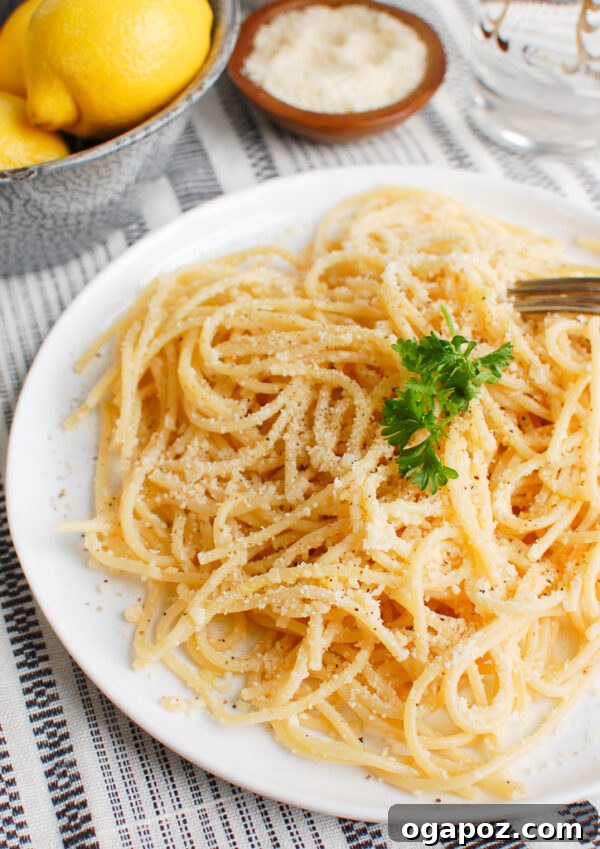 Bright Lemon Pasta 4 Lemon Pasta twirled on a fork, ready for a bite.
