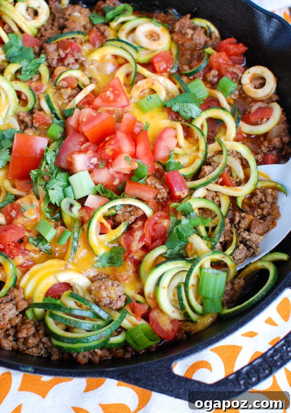 Zesty Mexican Zucchini Medley 2 Mexican Zucchini Recipe Black Skillet - A healthy, low-carb skillet meal featuring ground beef and fresh zucchini noodles, seasoned with taco spices and topped with fresh ingredients.