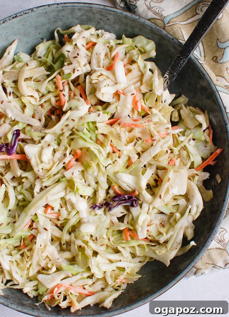Ultimate Creamy Coleslaw 2 A vibrant bowl of creamy coleslaw, showcasing fresh shredded cabbage and carrots.