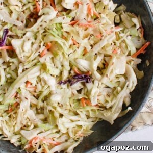Creamy Coleslaw Recipe in a beautiful white bowl, close up.