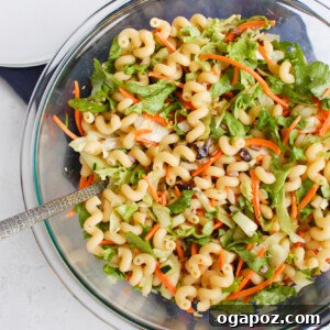A vibrant bowl of Asian Pasta Salad with fresh ingredients.