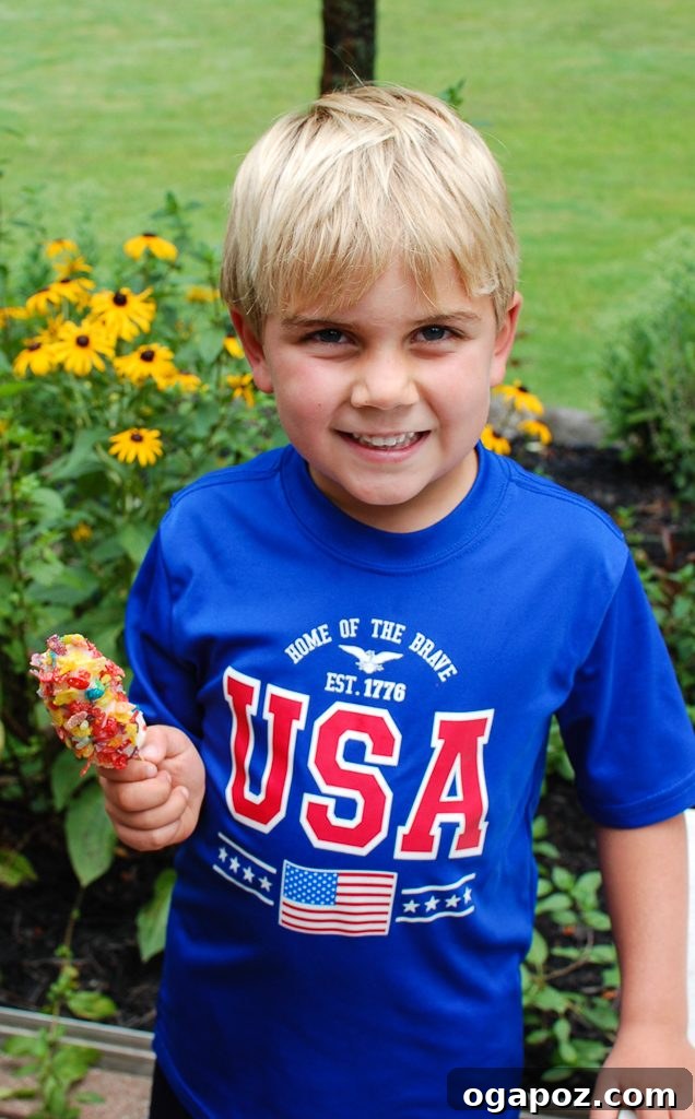 Banana Crunch Ice Pops 8 A child enjoying a Banana Crunch Popsicle outdoors