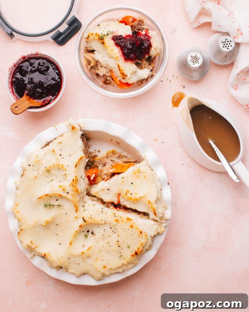 Hearty Winter Casseroles for Ultimate Comfort 25 Thanksgiving Leftovers casserole with layers of turkey, stuffing, and mashed potatoes, with a slice removed
