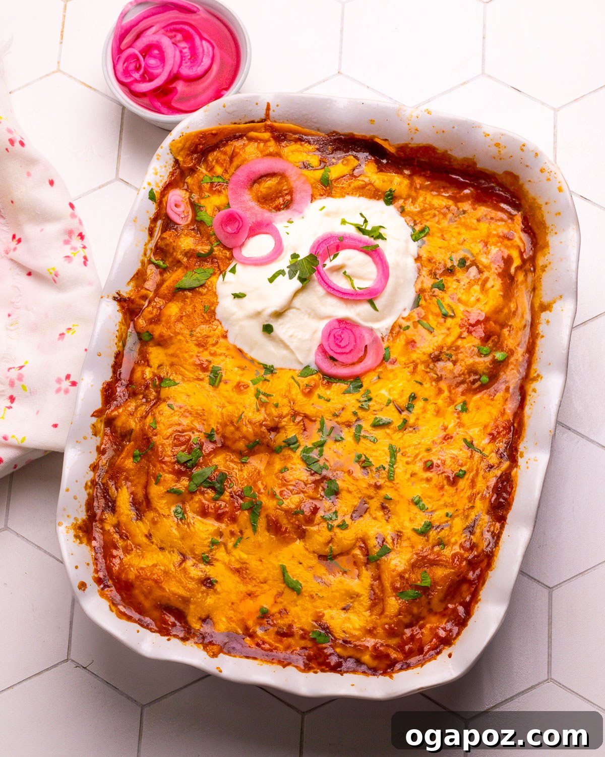 Hearty Winter Casseroles for Ultimate Comfort 6 Chicken enchilada casserole or chicken tortilla casserole topped with sour cream and pickled onions for a vibrant finish