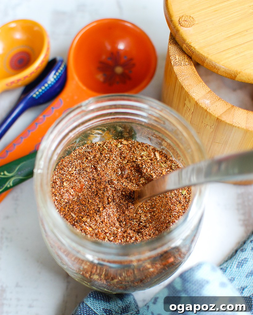Better-Than-Store-Bought Taco Seasoning 2 Homemade Taco Seasoning Recipe in a clear glass jar, with a rustic background