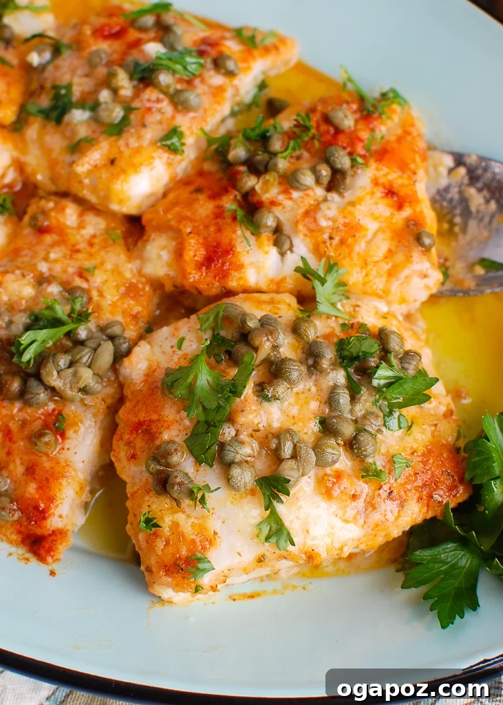 Zesty Lemon Cod Bake 2 Baked Cod with Lemon on a teal platter, garnished with fresh parsley.