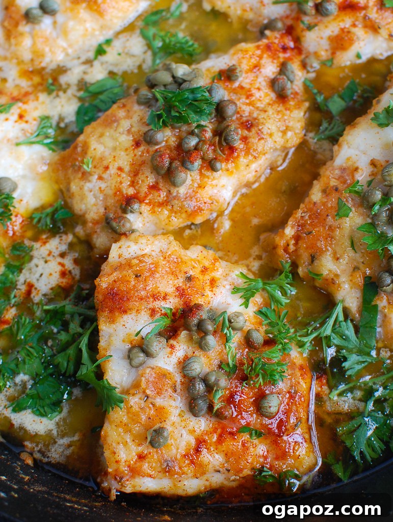 Zesty Lemon Cod Bake 4 Baked Cod with Lemon in a cast iron skillet, ready to serve.