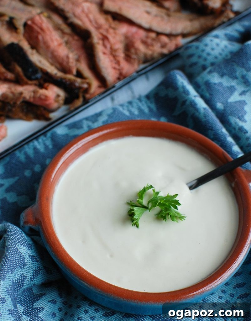 Creamy Tahini Dressing 4 Tahini Sauce served with grilled meat and fresh vegetables, showcasing its versatility