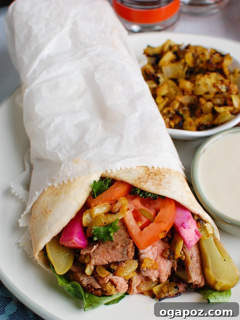 Creamy Tahini Dressing 5 Savory Beef Shawarma wrapped in pita bread, served with a side of creamy Tahini Sauce