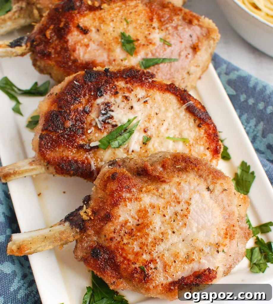 Mastering Tender Oven Baked Pork Chops 2 How to Bake Pork Chops in the Oven on white plate