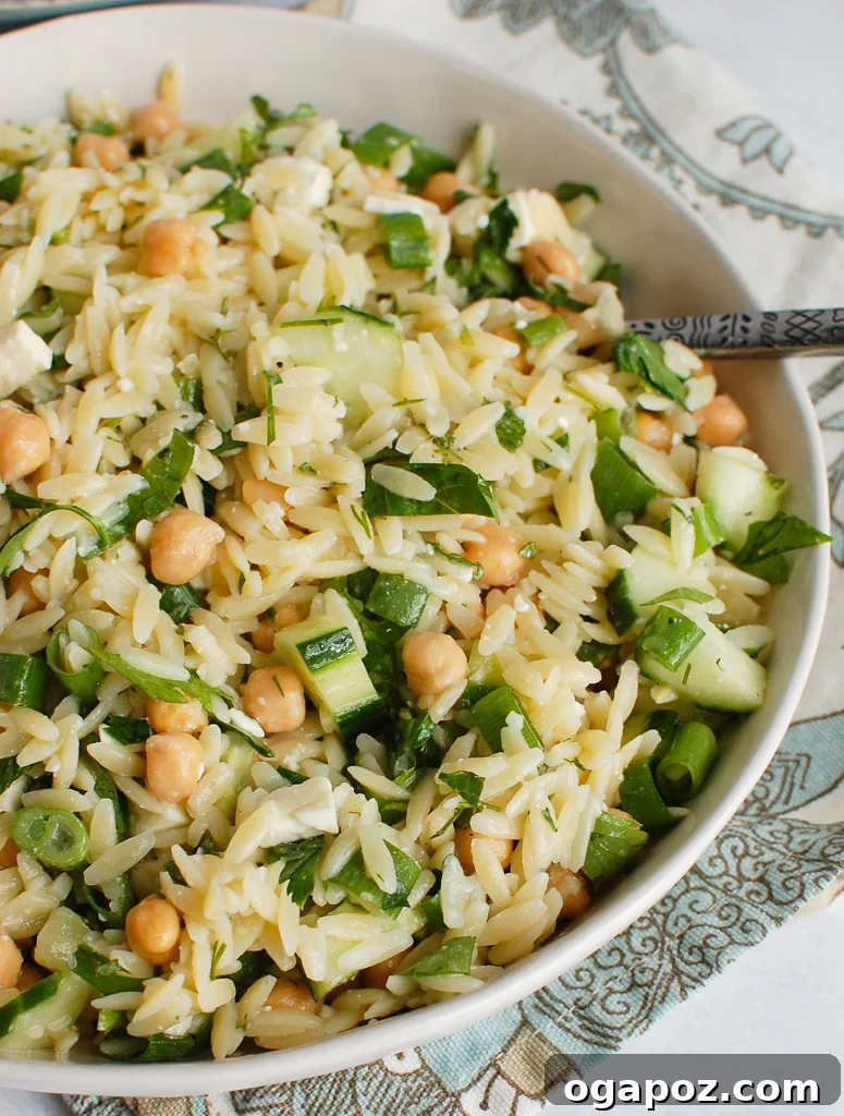 Zesty Chickpea Salad 5 Chickpea Salad Recipe with a spoon, showing the texture and fresh ingredients
