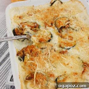 Zucchini Gratin in white casserole dish