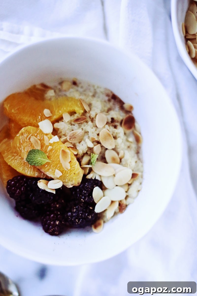 Quinoa Morning Fuel 3 Close-up of a saucepan filled with a creamy, simmering whole grain porridge, ready to be served.
