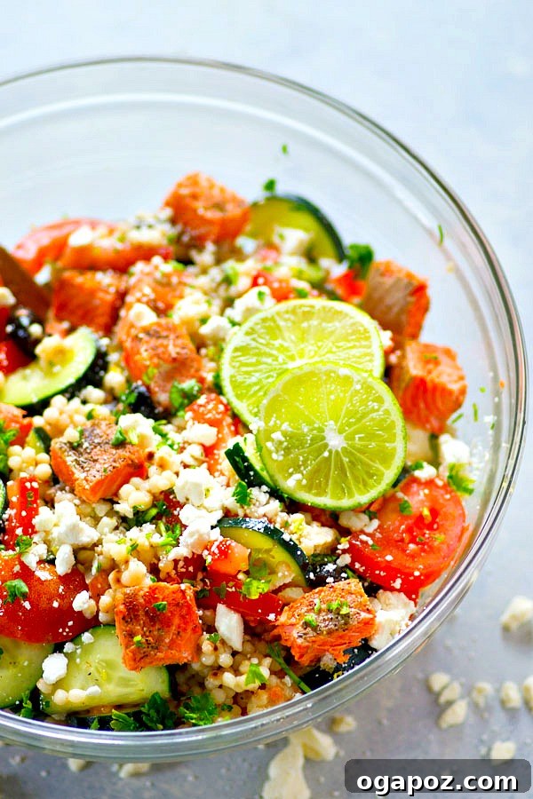 A gourmet Greek Seared Salmon Couscous Salad, combining perfectly seared salmon fillets with light, fluffy couscous and classic Greek vegetables.