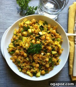 A wholesome Zucchini Chickpea Quinoa Salad, featuring fresh zucchini, protein-rich chickpeas, and fluffy quinoa, all tossed in a warmly spiced dressing.