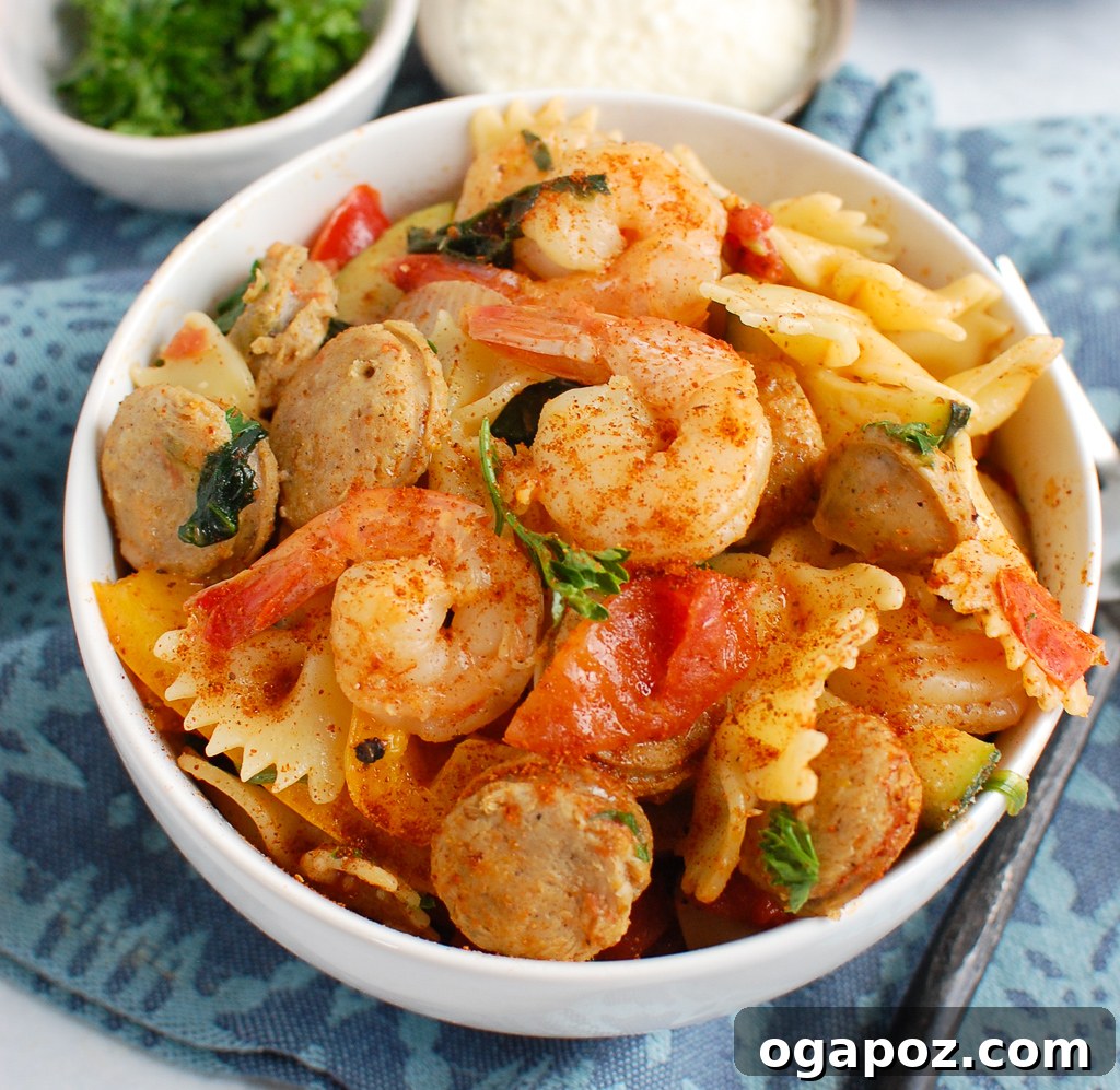 Fiery Cajun Pasta with Chicken Sausage and Shrimp 6 Cajun Pasta with Chicken Sausage and Shrimp ready to be served from a large bowl, highlighting its vibrant ingredients.