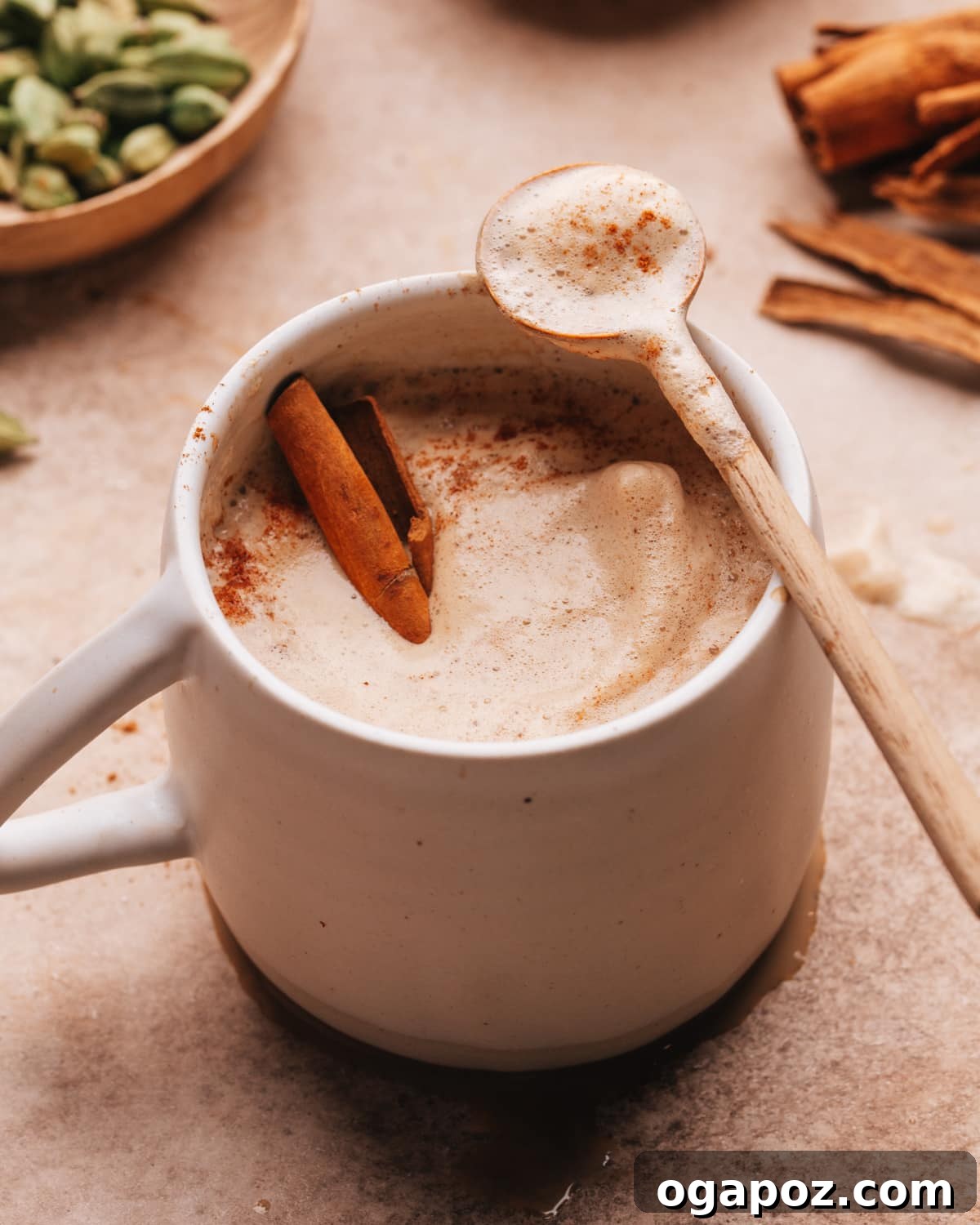 Velvet Froth Chai Coffee Delight 2 Chai coffee recipe with a spoon, highlighting its creamy texture and rich color.